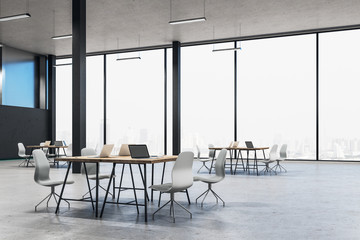Cozy workplace interior with laptops on table