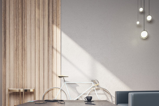Contemporary hipster interior with bicycle and blank wall.
