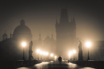 Dramatic View of the Charles Bridge in Prague on Misty Night