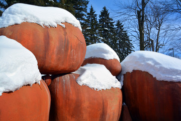 Huge red boulder in winter time Quebec Canada