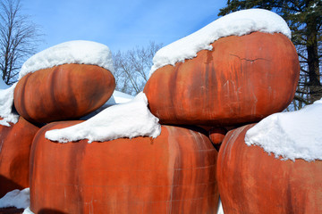 Huge red boulder in winter time Quebec Canada