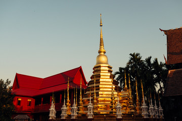 Fototapeta premium Buddhist golden stupa and monastery in the north of Thailand, Chiang Mai