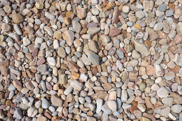 Seashore scree or Pebbled beach background.