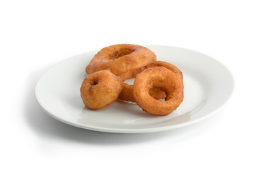 jumbo onion rings on aplate isolated on white