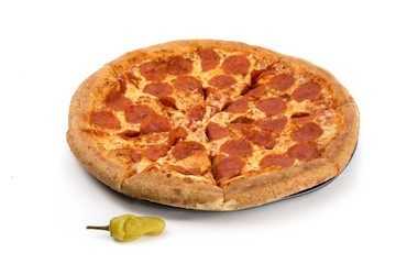 a freshly made pepperoni and cheese pizza on a metal pan isolated on white