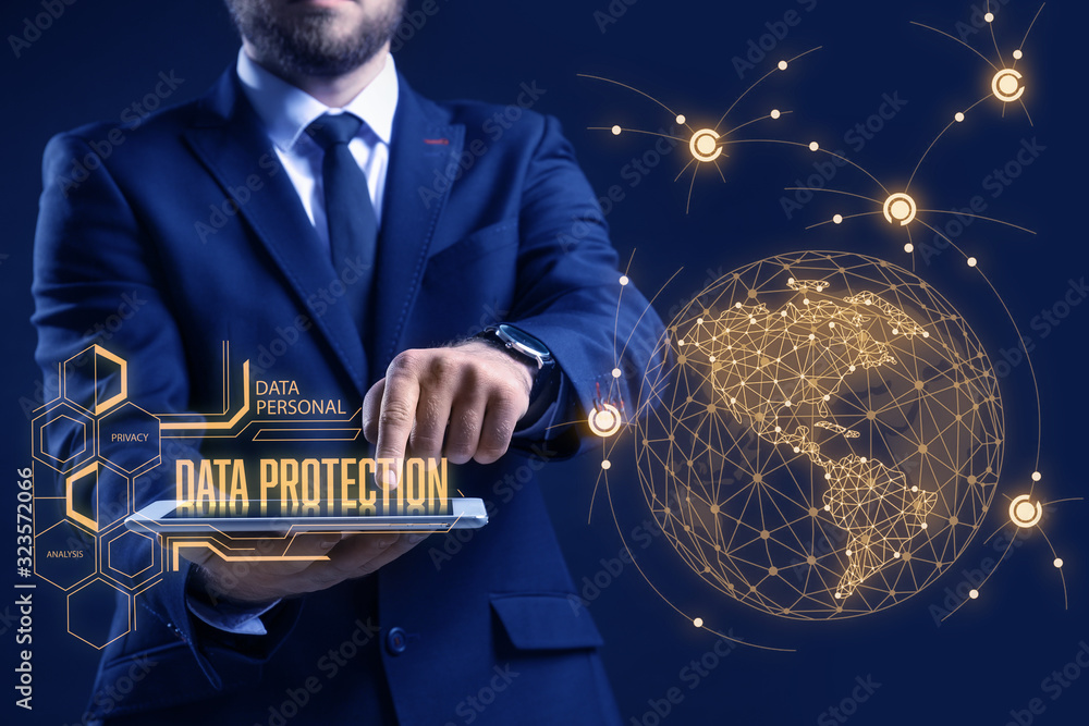 Poster businessman with tablet computer and hologram projection of data protection service on dark backgrou