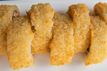 Sushi on the plate on the black table