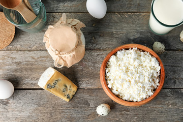 Different dairy products on wooden table