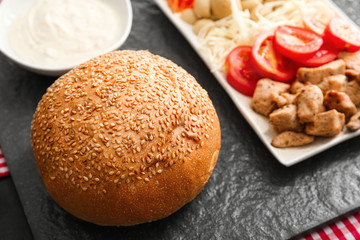 Ingredients for tasty doner kebab on dark background on table, closeup