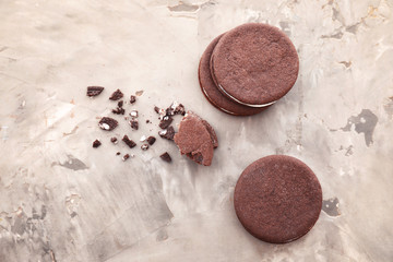 Tasty chocolate cookies on grey background