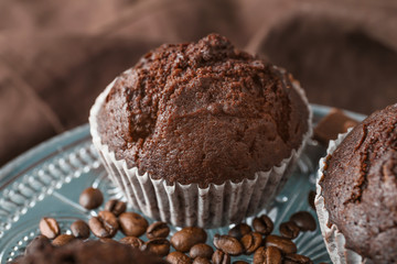 Dessert stand with tasty chocolate muffins, closeup