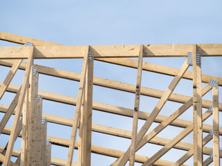 wood timber framing with truss plates for a residential construction project