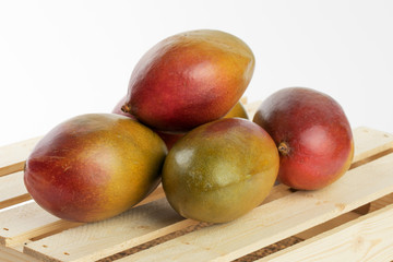 natural looking ripe Palmer mangoes isolated on white