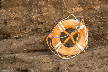 life ring on the cliffs , near the beach  
