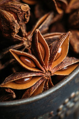 Dried anise stars on the rustic background. Selective focus. Shallow depth of field.