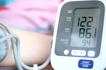 Man check blood pressure monitor and heart rate monitor with digital pressure gauge. Health care...