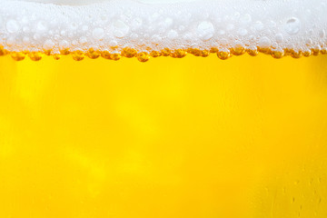 Background Cool beers with beer bubbles on top a glass at the party