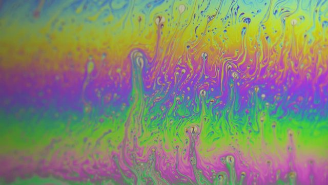 Soap Bubbles Macro - Iridescent Surface. Video Chemical Substances. Moving surface of colorful bubble patterns