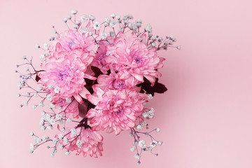 spring flowers, close-up of bright pink, pale pink chrysanthemums and small lilac flowers, bouquet composition. copy space