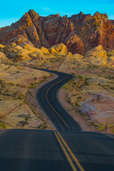 Road Winds through Dramatic Desert Landscape at Sunrise Sunset Valley of Fire