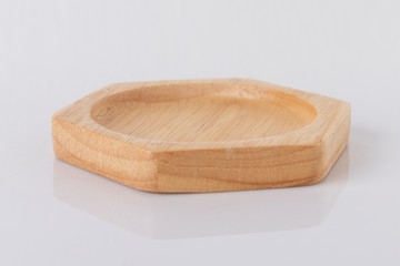 Hexagon shaped wooden tray on a white background