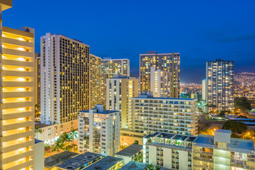Fototapeta na wymiar Night view nature and cityscape concept: evening outdoor urban view of modern real estate city in Honoluu, Hawaii.