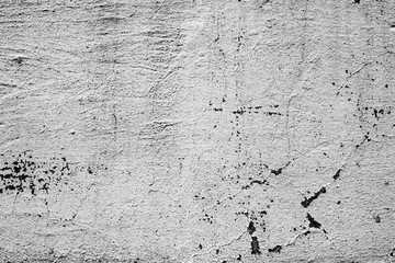 Fototapeta premium Texture of a concrete wall with cracks and scratches which can be used as a background