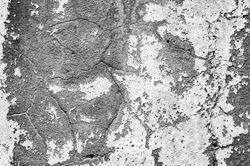 Texture of a concrete wall with cracks and scratches which can be used as a background