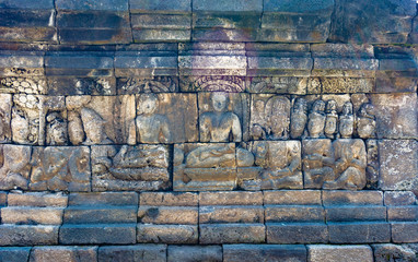 Stone carvings in Borobudur Temple, Magelang, Central Java, Indonesia. Borobudur Temple is the...