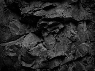 Black white stone background. Mountain close-up. Beautiful rock texture. Detail. Volumetric rocky background. 3D effect.