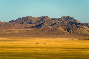 Landscape of yellow grassland and mountains of China.