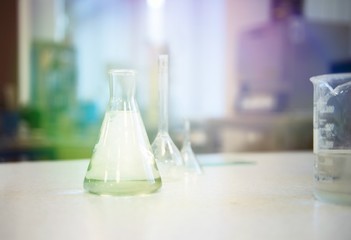 Colourful glass bottles for lab procedures bottles and flasks. essentia oils products-treatment medical 