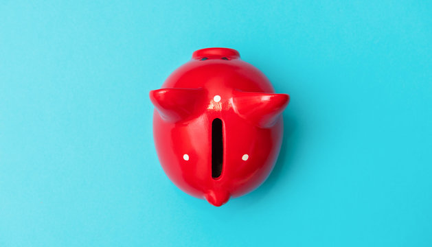 Red piggy bank. Business concept, top view