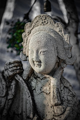 Fototapeta na wymiar Statue of a Thai woman in the temple garden