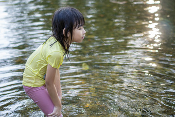 Asian child cute girl Play Swim happy smile In the canal
