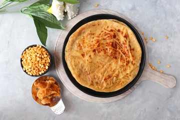 Holi Festival Food - Puran Poli is an Indian sweet flatbread stuffed with mixture of chana dal,...