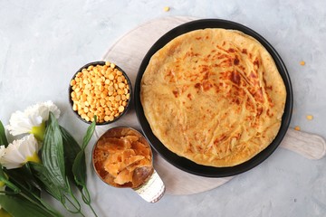 Holi Festival Food - Puran Poli is an Indian sweet flatbread stuffed with mixture of chana dal, jaggery, ghee & cardamom. Usually eaten on Holi or Gudi Padva festival. Recipe ingredients. copy space.