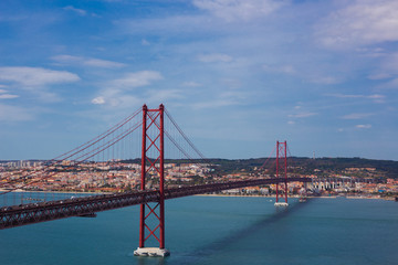 Fototapeta na wymiar Ponte 25 de Abril is a suspension bridge connecting the city of Lisbon, to the Almada