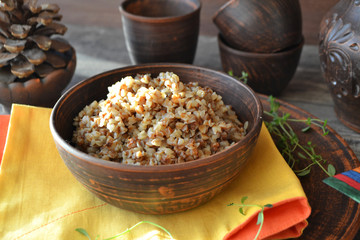 Russian cuisine. Traditional bowl with buckwheat porridge.