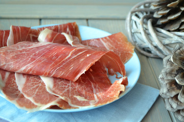 Lomo thin pieces of cured marbled meats.