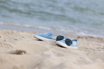 the sneakers on the beach
