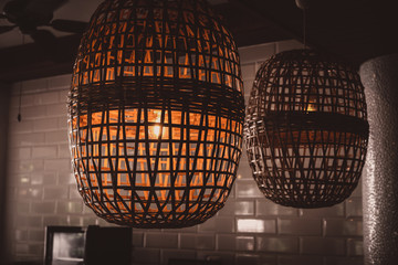 Obraz premium Wooden wicker chandelier lamp loft style.