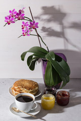 Delicious breakfast with coffee and homemade pancakes with jam.