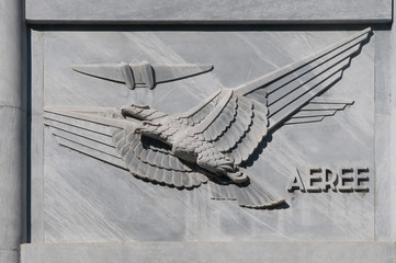 Bas-relief in fascist style depicting the air mail service, on the facade of the central post...