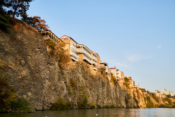 Traditional house on the top of rock in downtown in the old center of the city Tbilisi in Georgia in a day