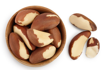 Brasil nuts in wooden bowl isolated on white background with clipping path and full depth of field. Top view. Flat lay