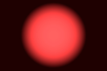 A black background with a colored light in the center