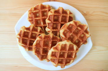 Top View of a Plate of Belgian Waffles on Wooden Table