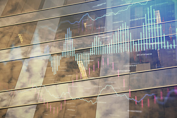 Forex chart on cityscape with tall buildings background multi exposure. Financial research concept.