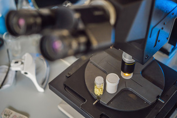 Fototapeta na wymiar Science lab research safe of new drugs, microscope and pills coronavirus